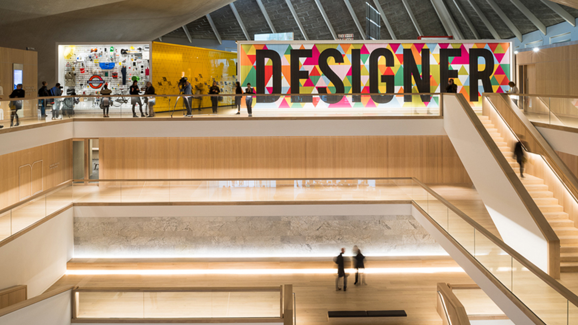 The Design Museum Atrium Illuminated Sign Staircase Warm Light Architectural Lighting Design Consultants Nulty