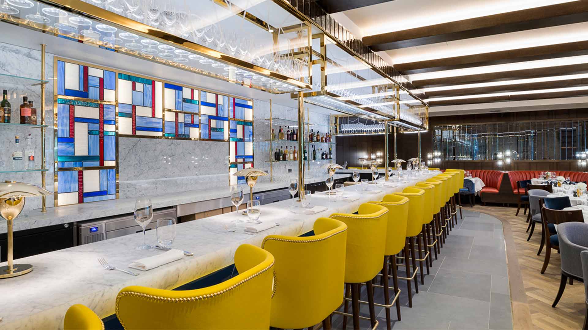 Integrated LED Lighting Glass Shelving Elegant Marble Bar Mondrain Feature Wall Yellow Stools Nulty