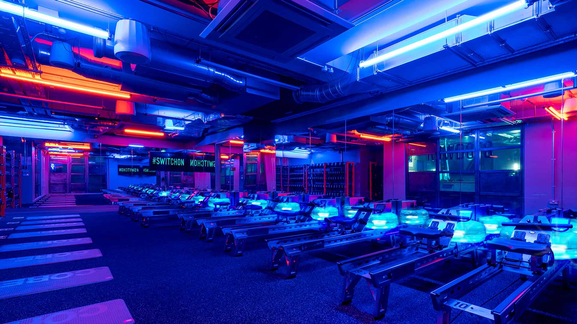 Lighting Design Rowbots Boutique Rowing Gym Dramatic Bold Blue Amber Light Workout Studio Consultant London Nulty