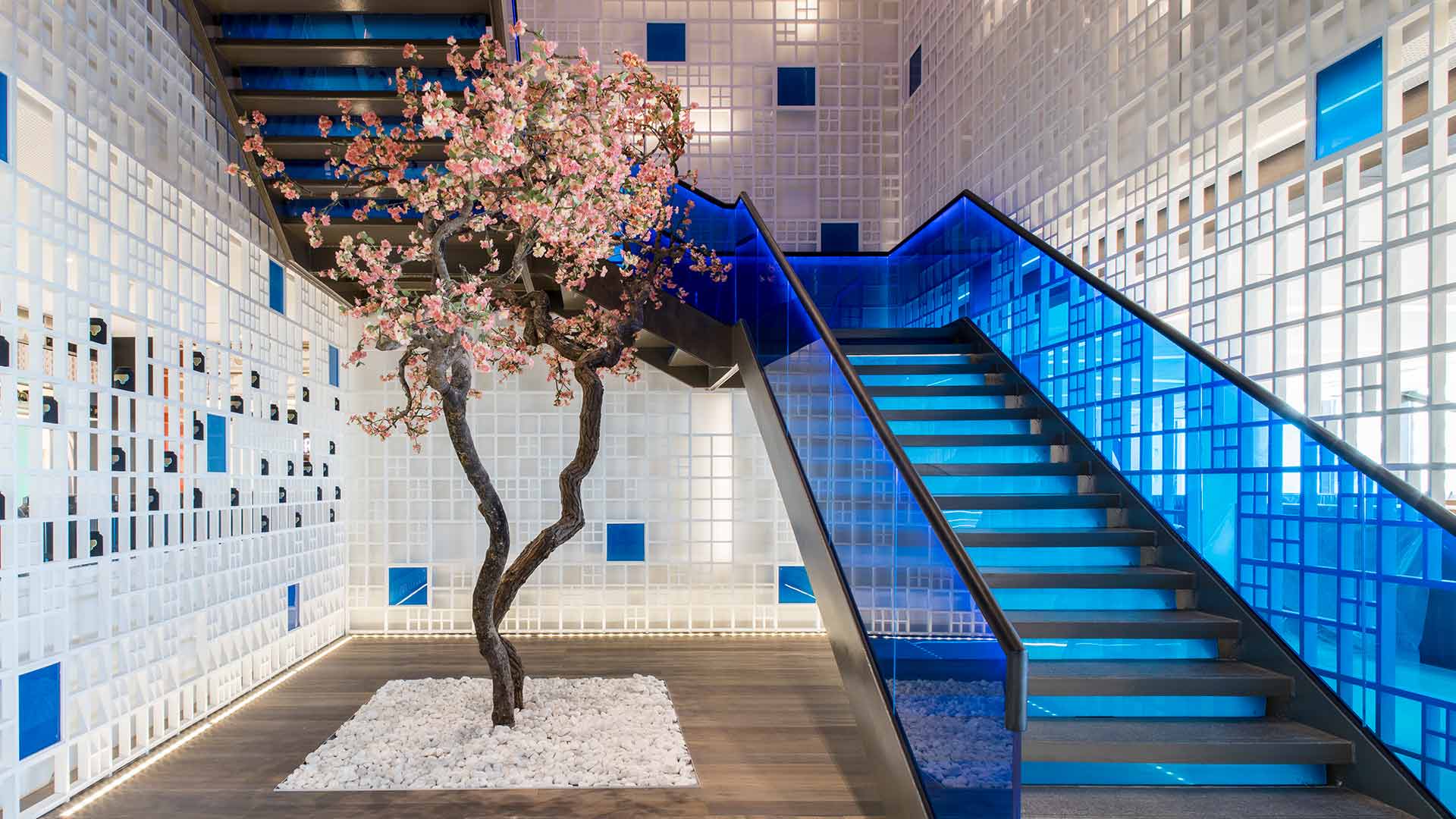 Lighting Design Restaurant Entrance Blue Staircase Blossom Tree Perimeter Uplighting Integrated Feature Wall Illumination Yautacha Riyadh Nulty