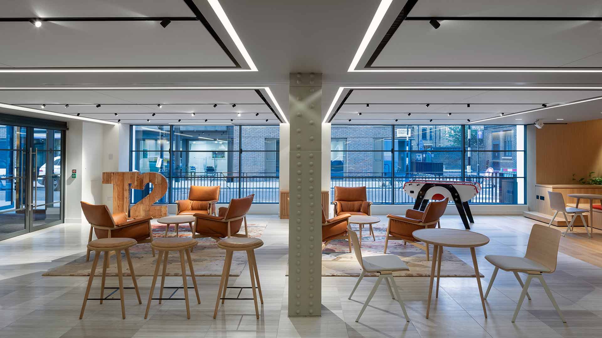 London Office Breakout Townhall Space Recessed Linear Lighting Illuminating Welcoming Workspace Interior Lighting Designers Nulty