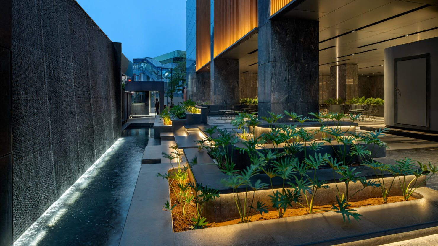 A three-tiered garden is lit with warm 2700K LEDs that trace each level, creating a gentle play of light and shadow